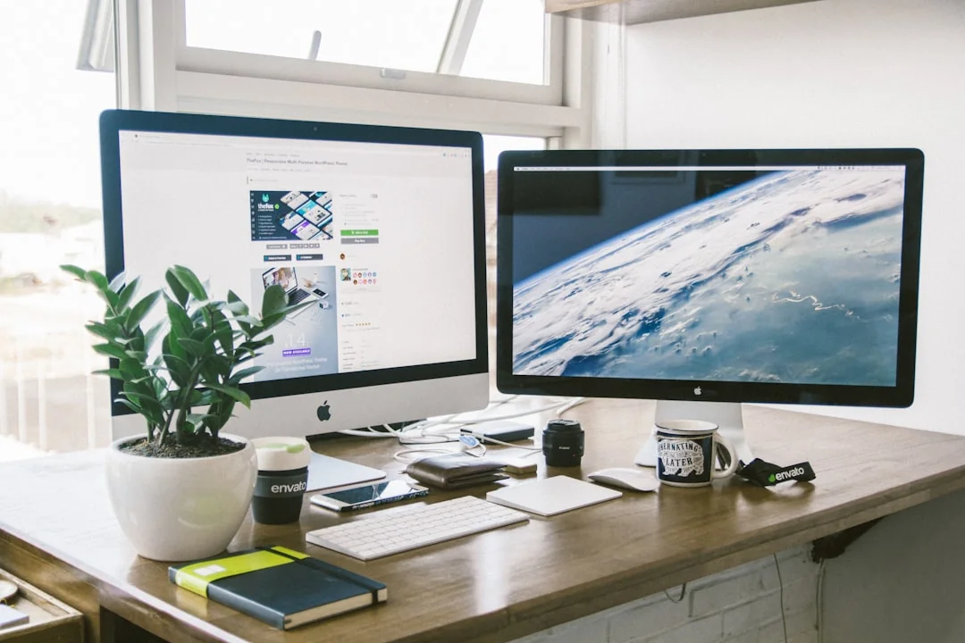 Un espace de travail moderne avec des ordinateurs, des graphiques et des fournitures de bureau, dans une ambiance propice à la productivité.